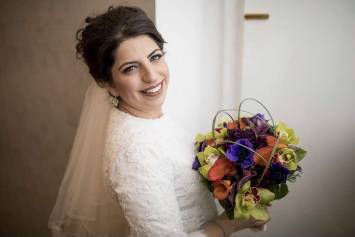 Bride with elegant updo and bouquet — on-location styling by Kalo Beauty Simplified
