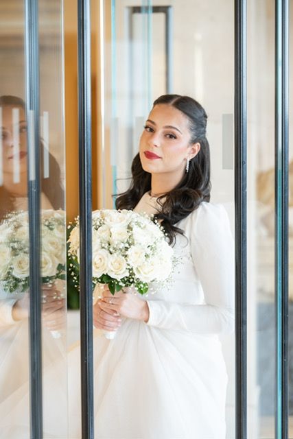 Bride with soft glam makeup holding white roses — on-location makeup by Kalo Beauty Simplified
